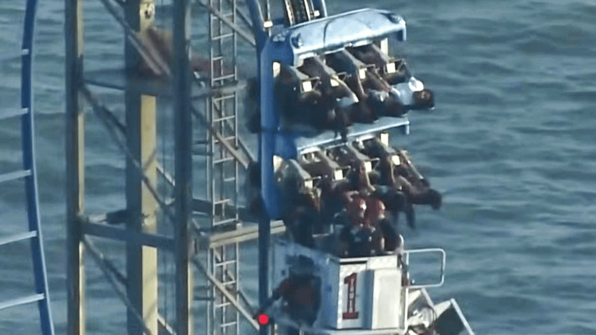 Eight students rescued after being trapped upside down on 100ft-high rollercoaster for three hours