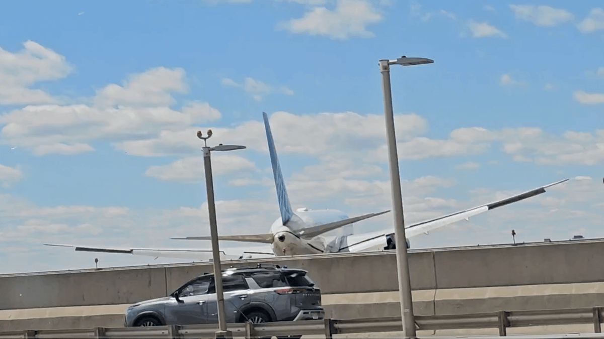 United Airlines flight carrying 221 passengers hits truck and light pole while landing at Newark airport