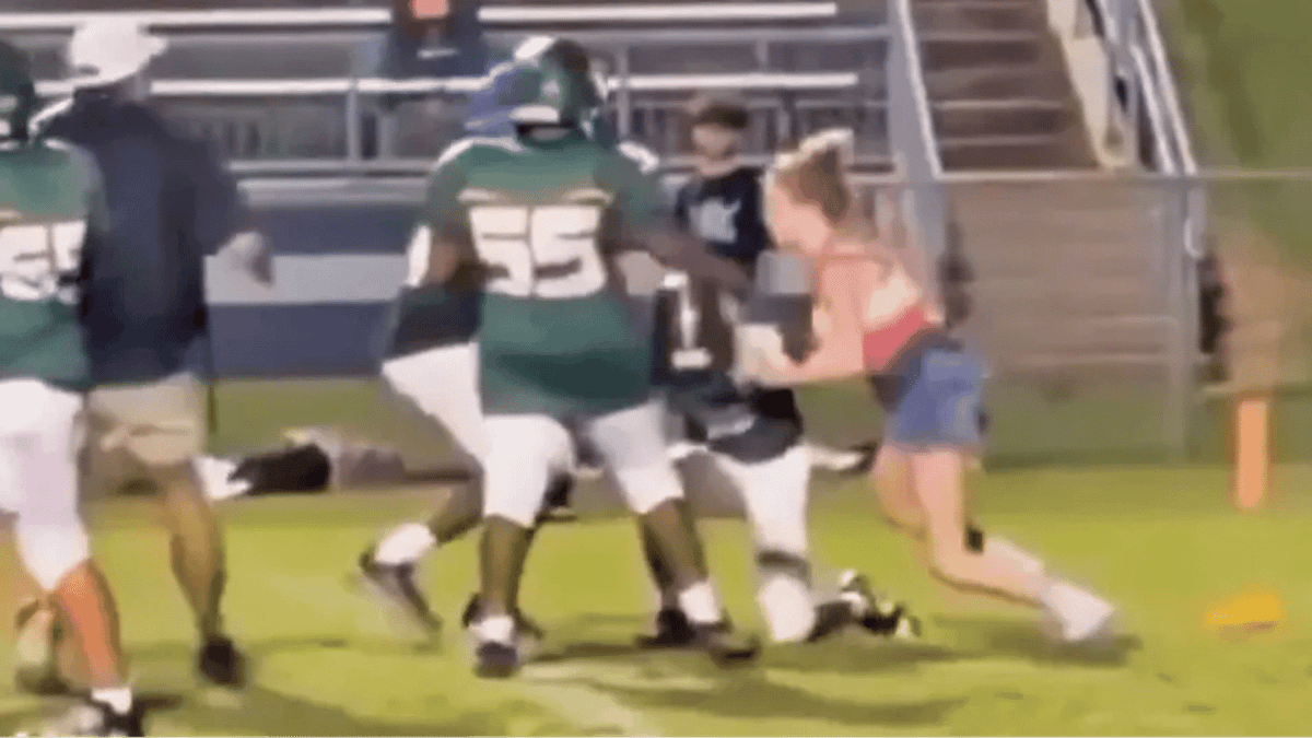16-year-old girl explains why she charged onto football field and tackled player during brother's game