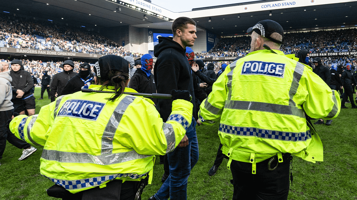 Old Firm derby ends in ugly scenes as Rangers and Celtic fans storm pitch