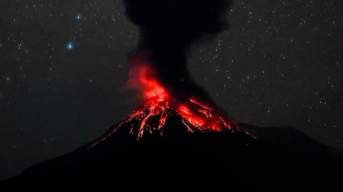 Thousands flee as Indonesian volcano spews ash 11 miles into the air