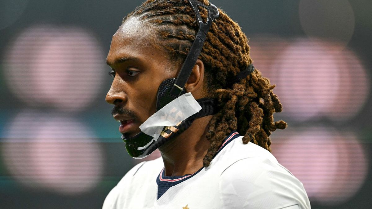 Why does Djed Spence wear a jaw brace when playing for England?