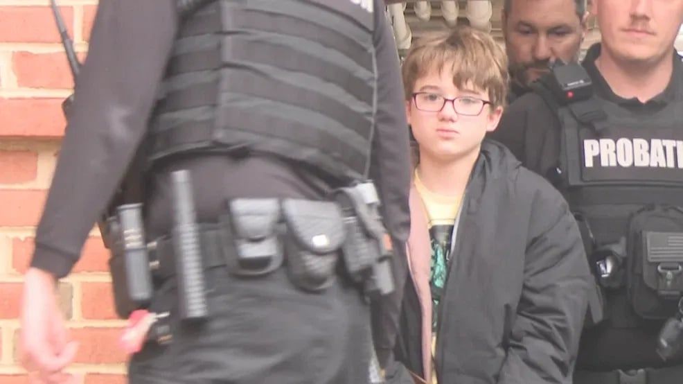 Boy, 11, accused of killing dad for 'taking away Nintendo Switch' led in handcuffs to court