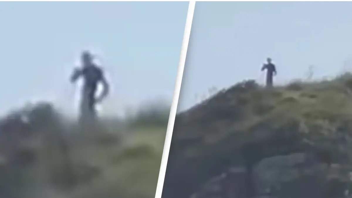 Hikers capture bizarre footage of '10ft tall aliens' watching over hilltop
