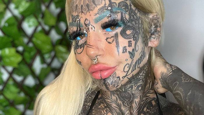 'World's most tattooed' woman shares 'insane' footage of getting her eyeballs inked blue