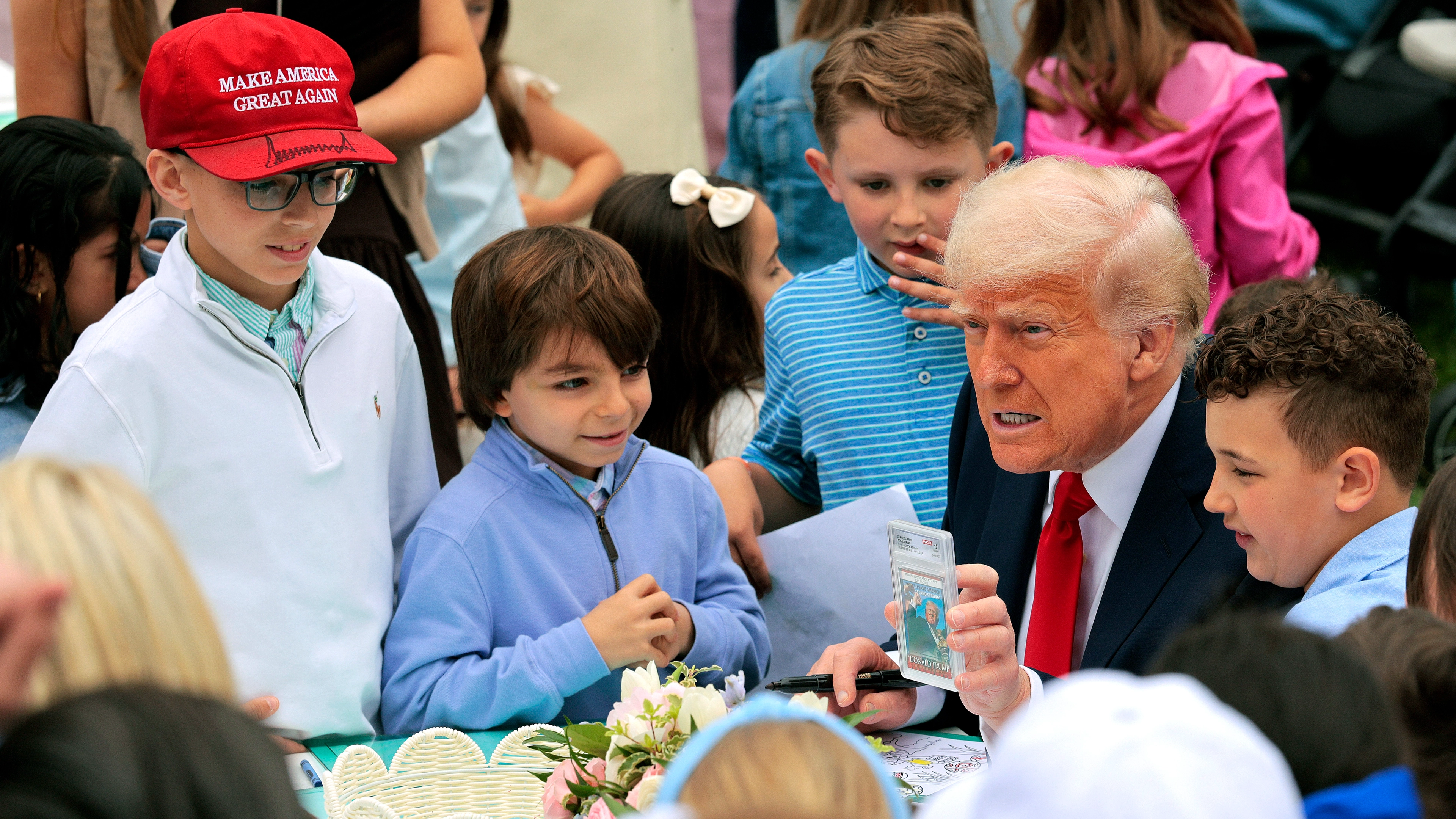 Donald Trump slammed after being spotted showing controversial photo to kids
