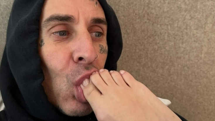 Travis Barker shares bizarre Kourtney Kardashian toe-sucking photo - fans are distracted by unusual detail