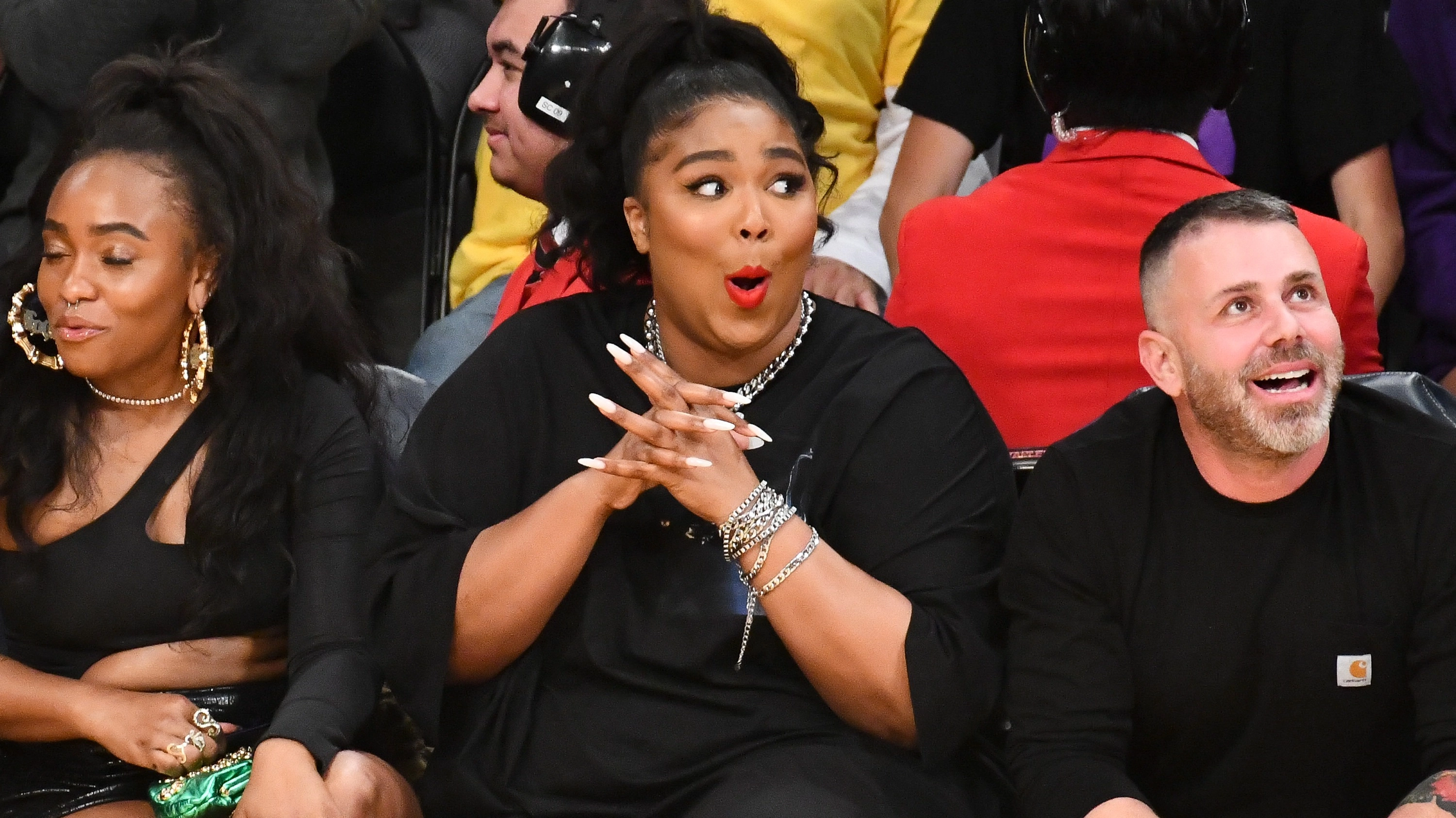 Lizzo shares image of her butt cheeks and declares she’s ‘not woke’