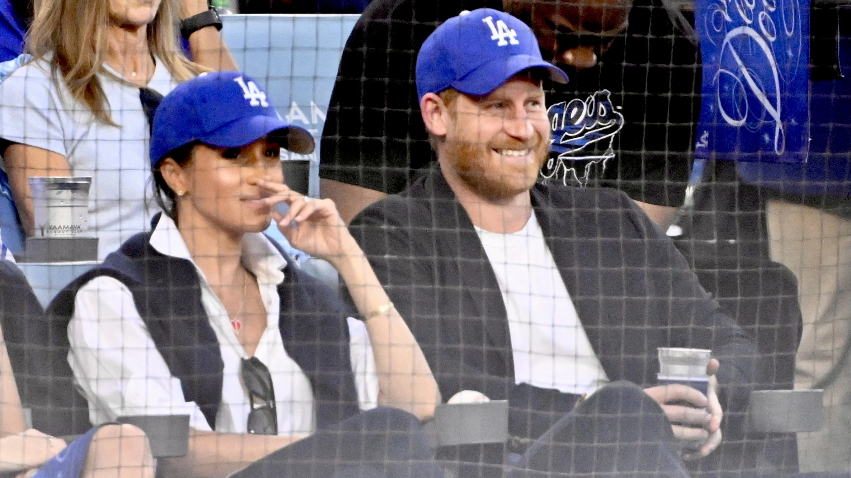 Lip reader reveals instruction Meghan whispered to Harry during unexpected sports appearance