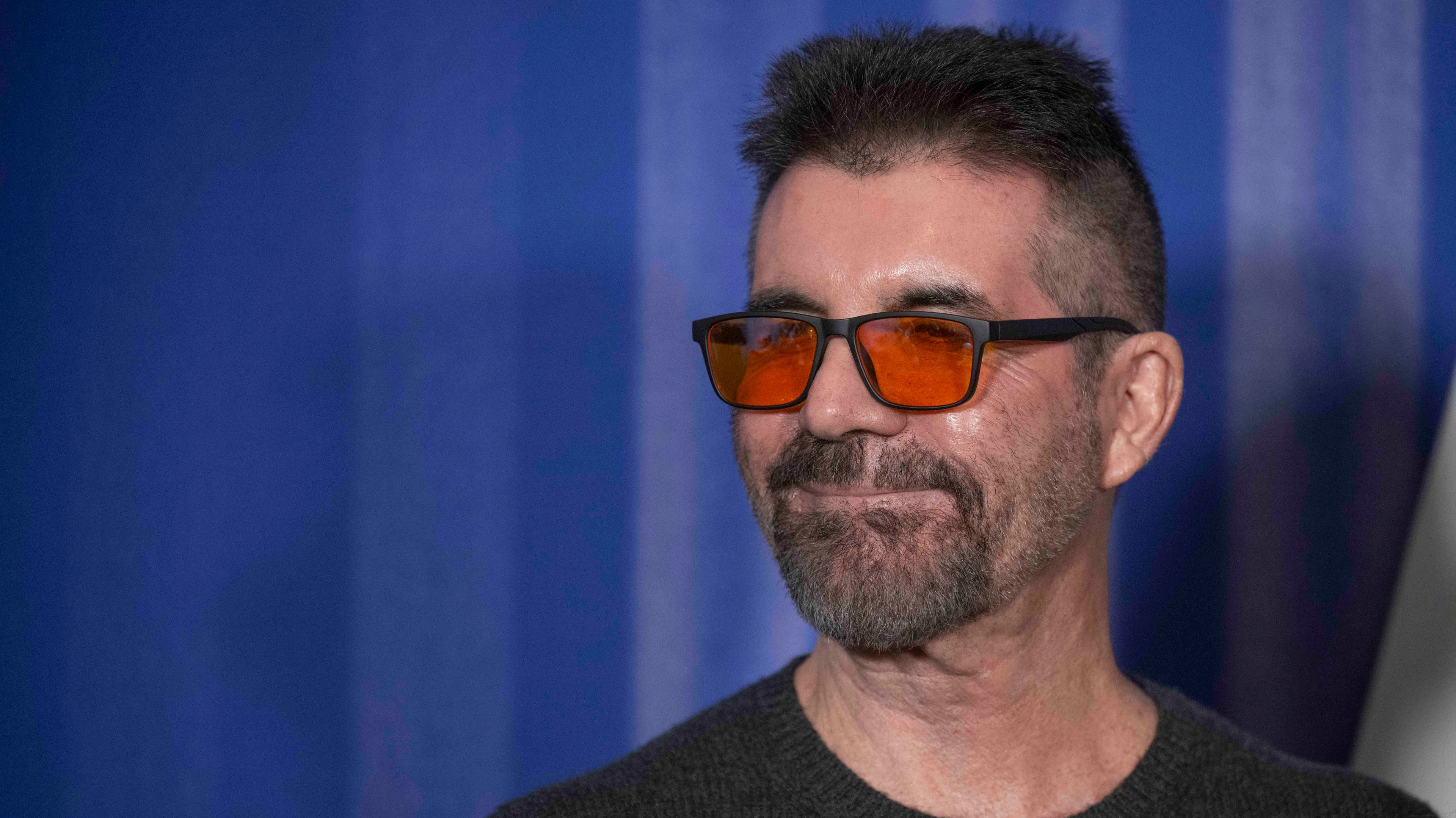 Sad reason Simon Cowell always wears orange glasses