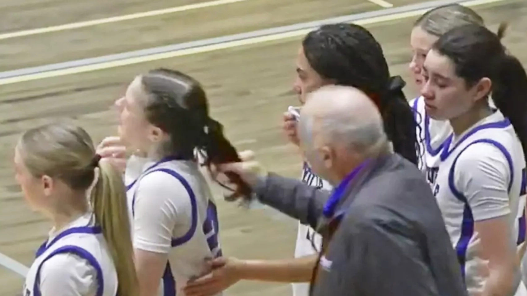 Lip reader 'reveals' what high school coach who got fired for pulling athlete's hair told players during furious rant