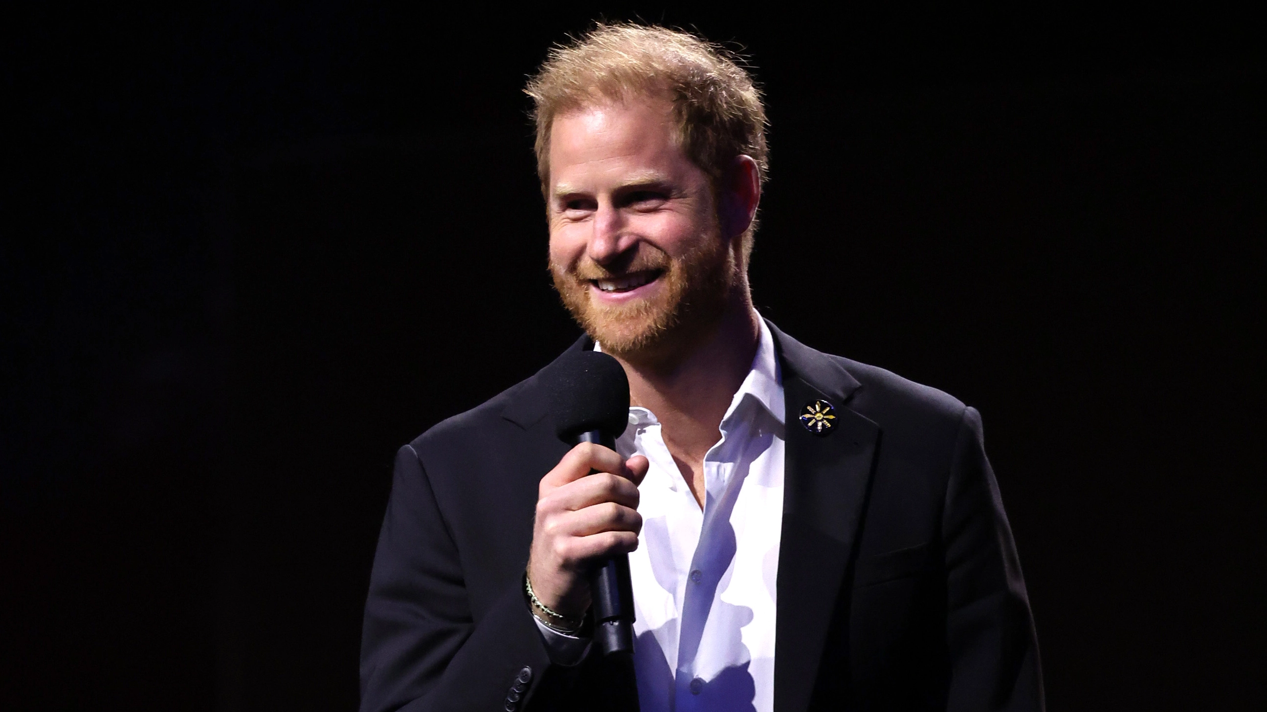 Prince Harry appears to make another savage dig at Donald Trump in speech during surprise visit