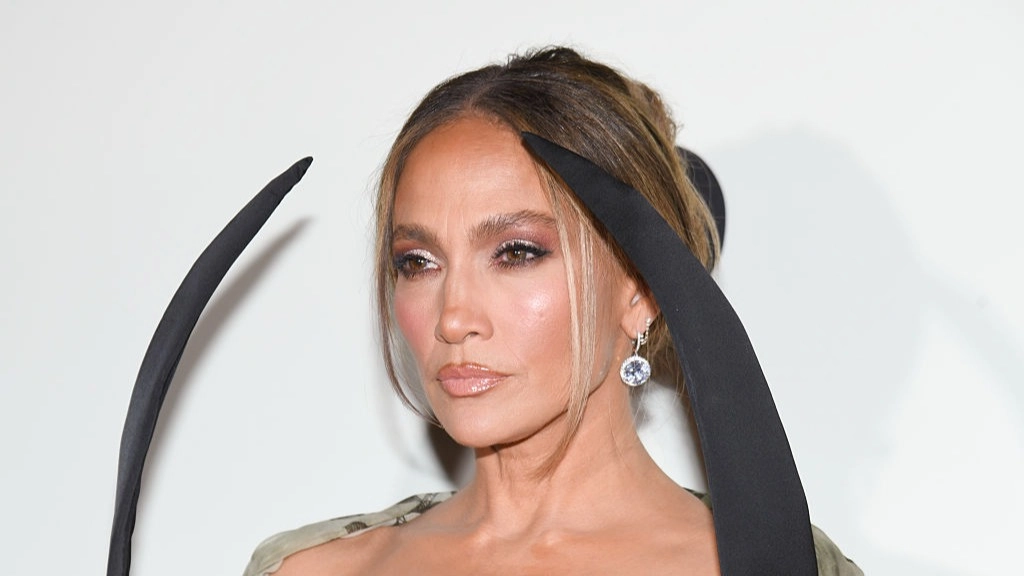 Awkward moment Jennifer Lopez corrects reporter who tried to sing to her on red carpet