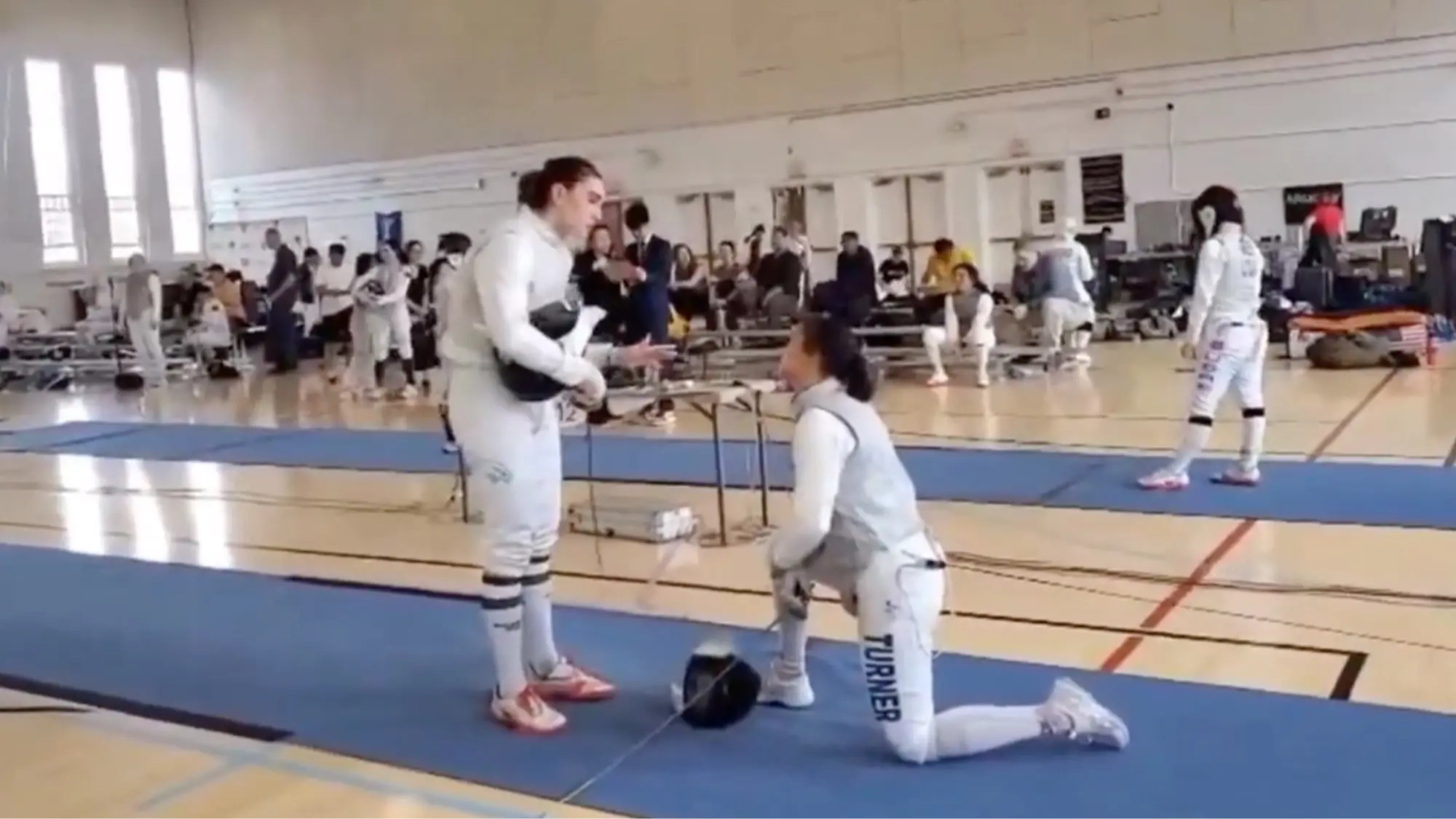 Female fencer breaks silence after being punished for taking knee and refusing to compete against transgender opponent