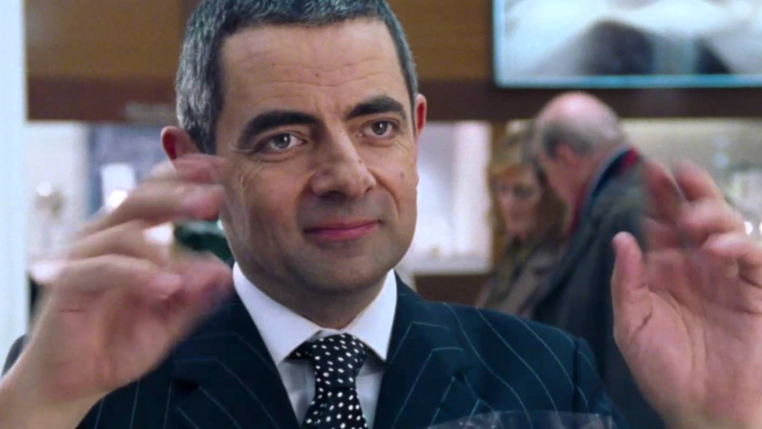 Rowan Atkinson finally confirms viral Love Actually theory about why he took so long to wrap necklace