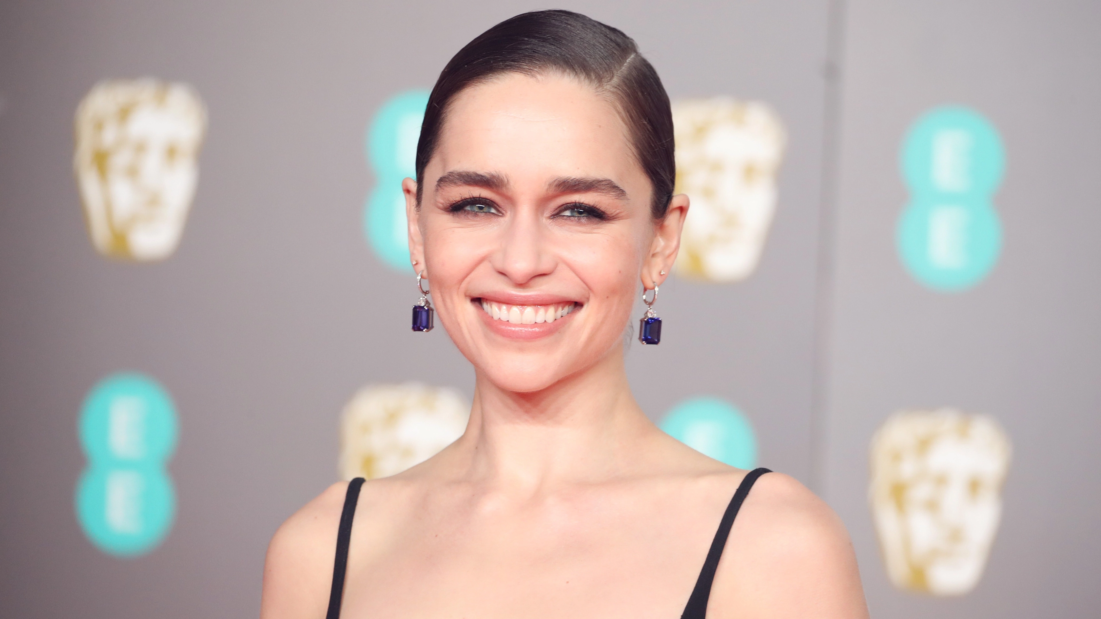 Emilia Clarke reveals how she 'broke a rib' while filming NSFW sex scene with three men