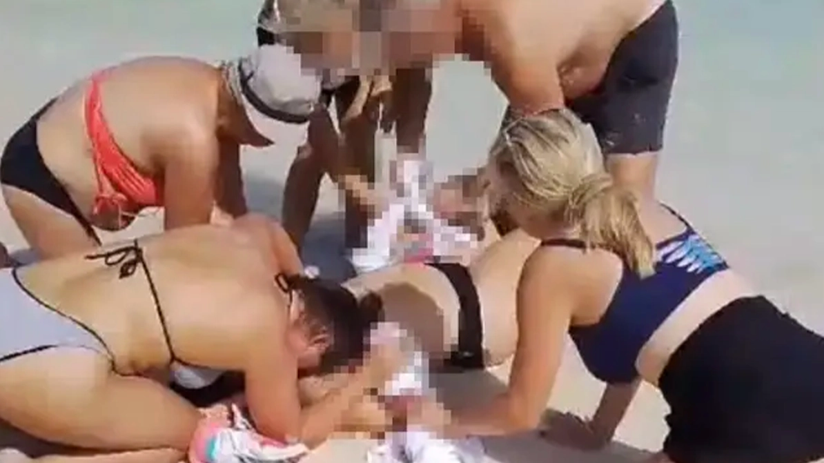 Brave husband 'tried to fight off shark' which bit off both wife's hands as authorities issue warning