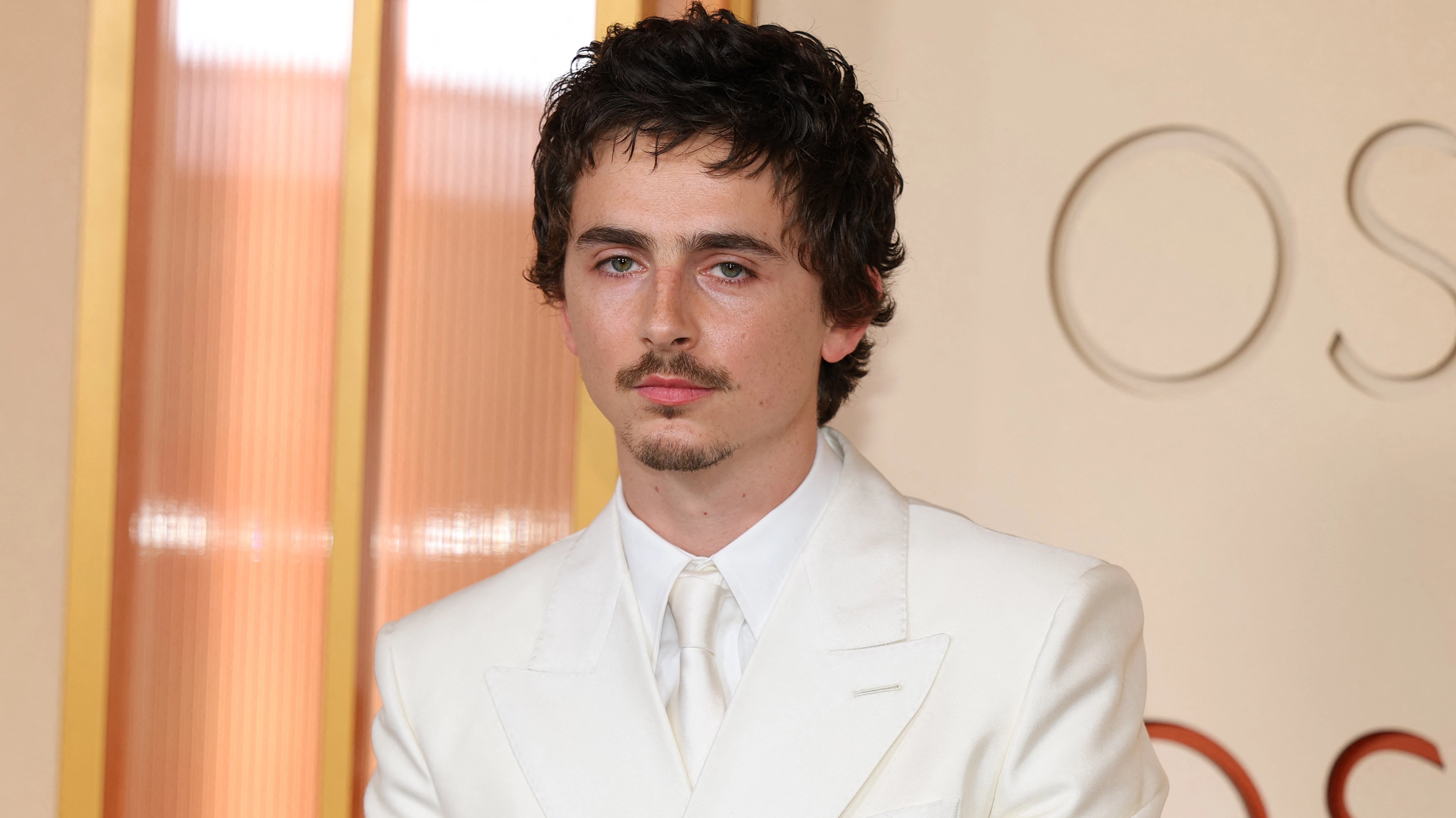 Oscars host slammed for 'not funny' and 'weird' bum drum joke directed at Timothée Chalamet
