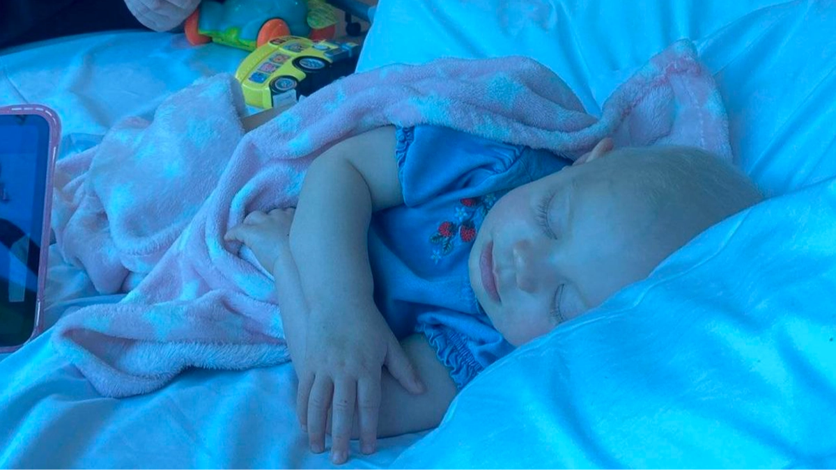 Young girl's rare cancer discovered after mom spotted 'secret' sign in photograph