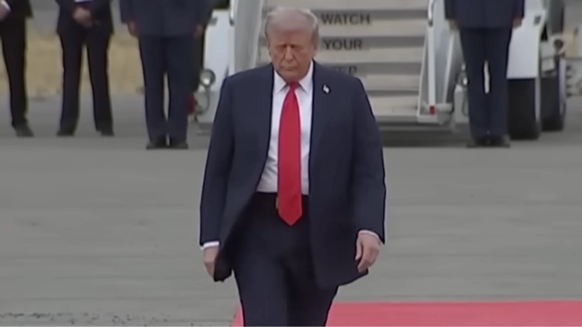 People think there’s a sinister reason why Trump was walking in a zig zag before greeting Putin