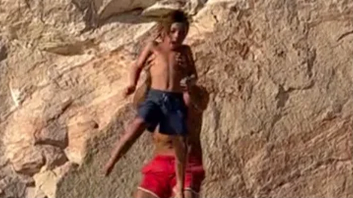 Dad throws his son, 7, off cliff to teach lesson on facing fears and sparks controversy