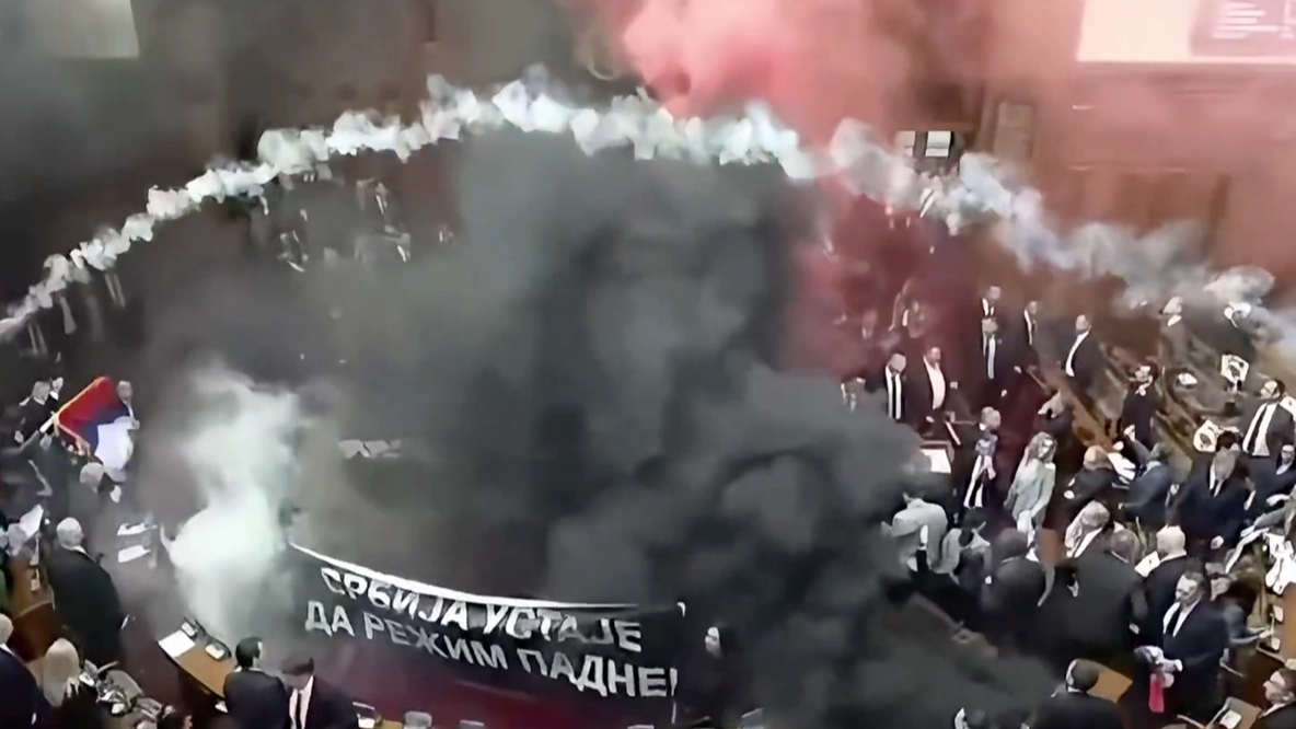 Serbian parliament erupts into chaos after opposition sets off smoke grenades and tear gas