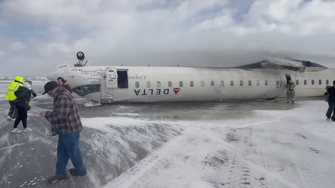 Passenger posts horrifying video of inside Delta plane moments after it flipped upside-down in crash landing