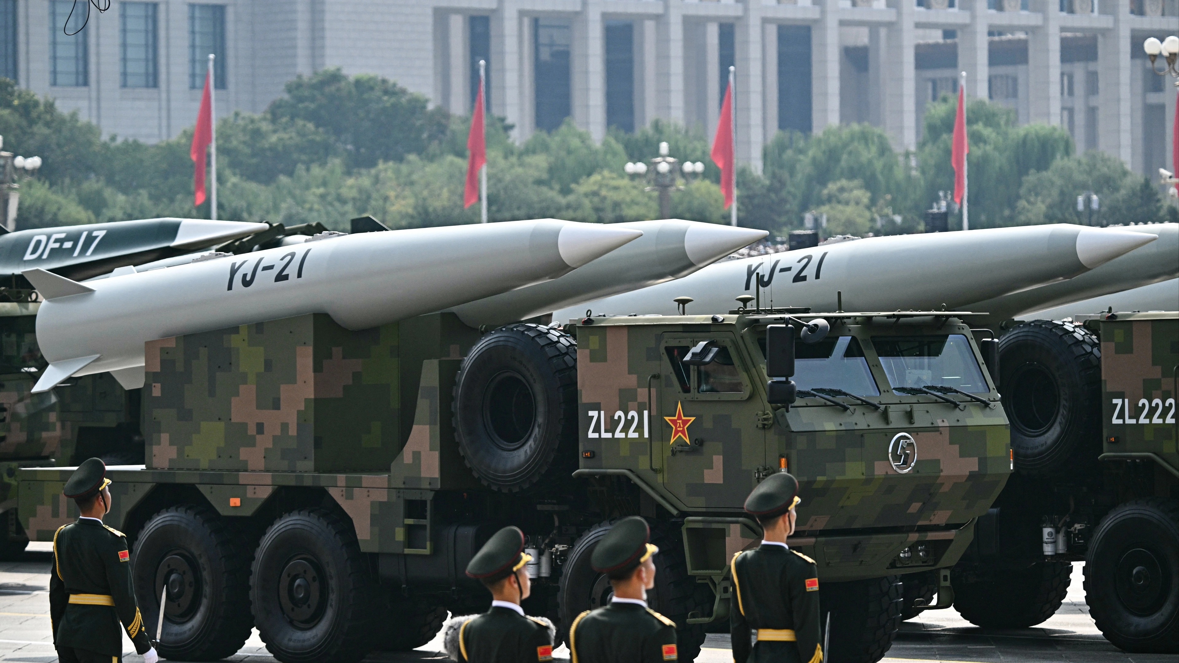 China unveils new weapons and nuclear missiles while issuing warning at military parade