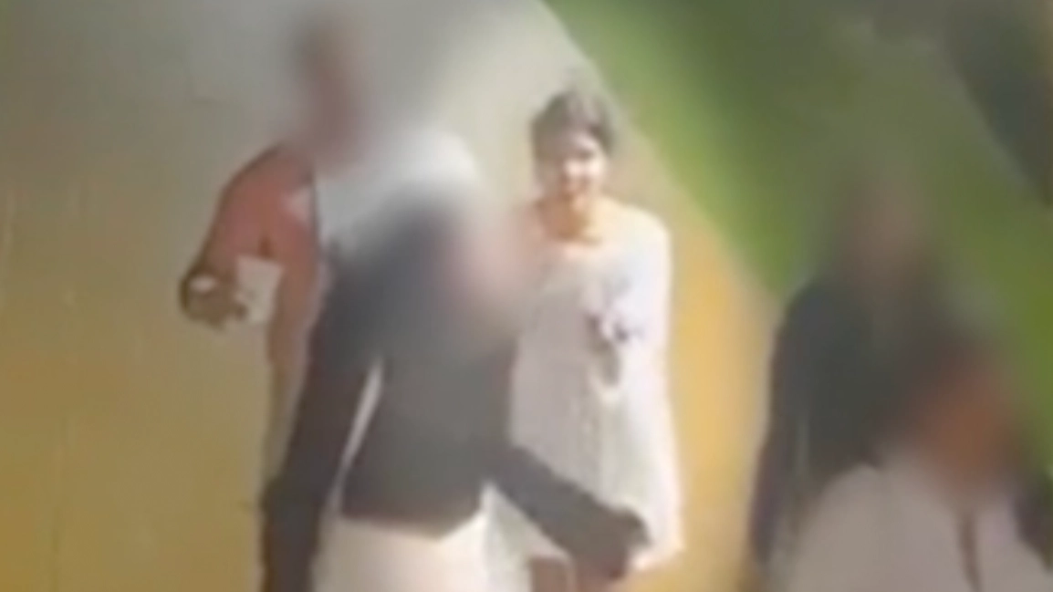 Surveillance footage shows missing university student walking with person of interest in last known whereabouts