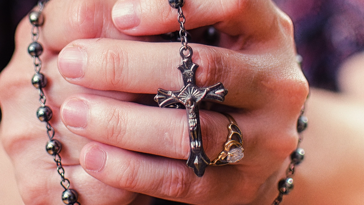 Plane passenger 'swallows rosary beads' and allegedly attacks flight crew before Satanic claim