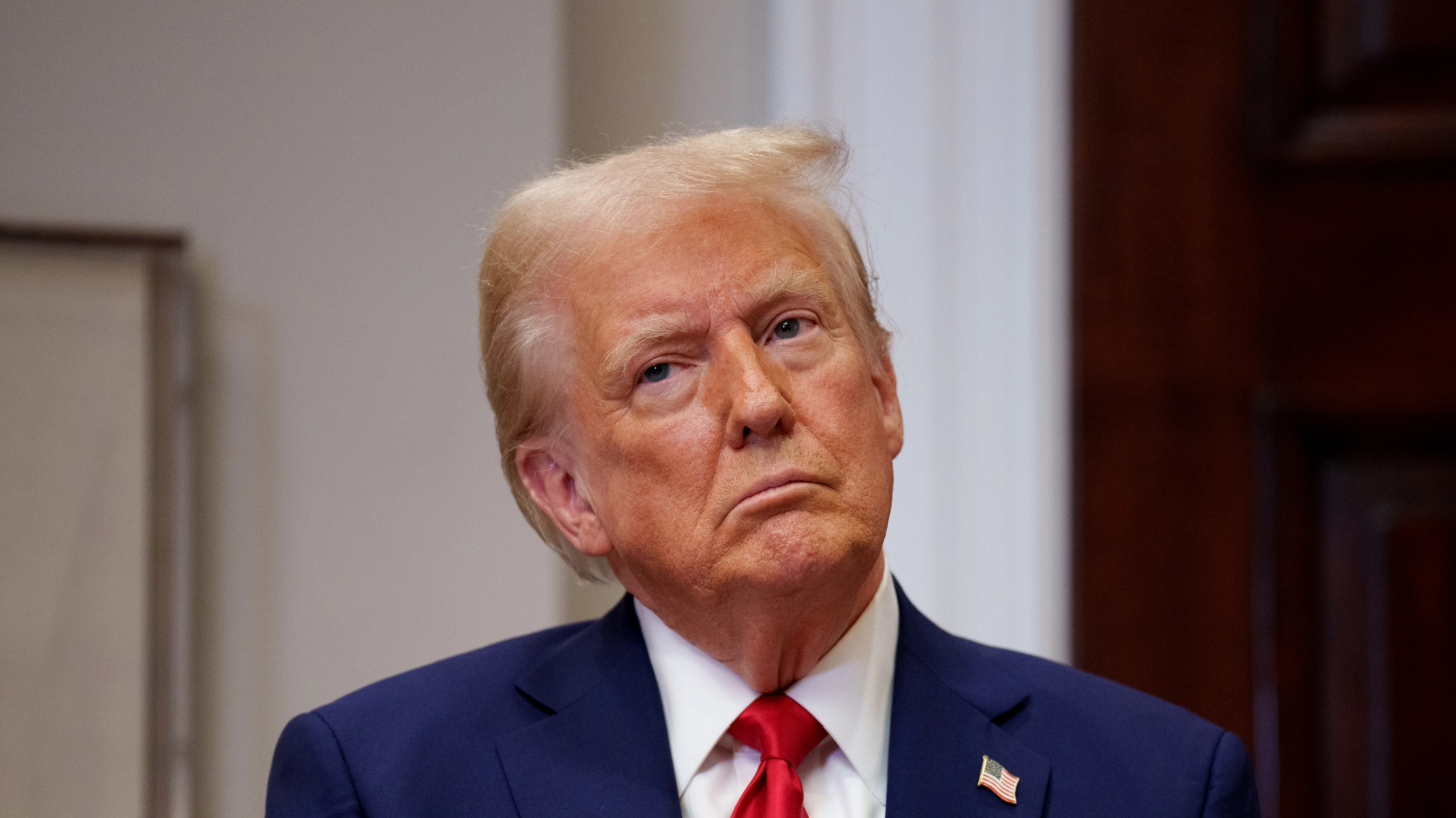 Video of Donald Trump kissing Elon Musk's feet played on TVs inside government building in shocking stunt
