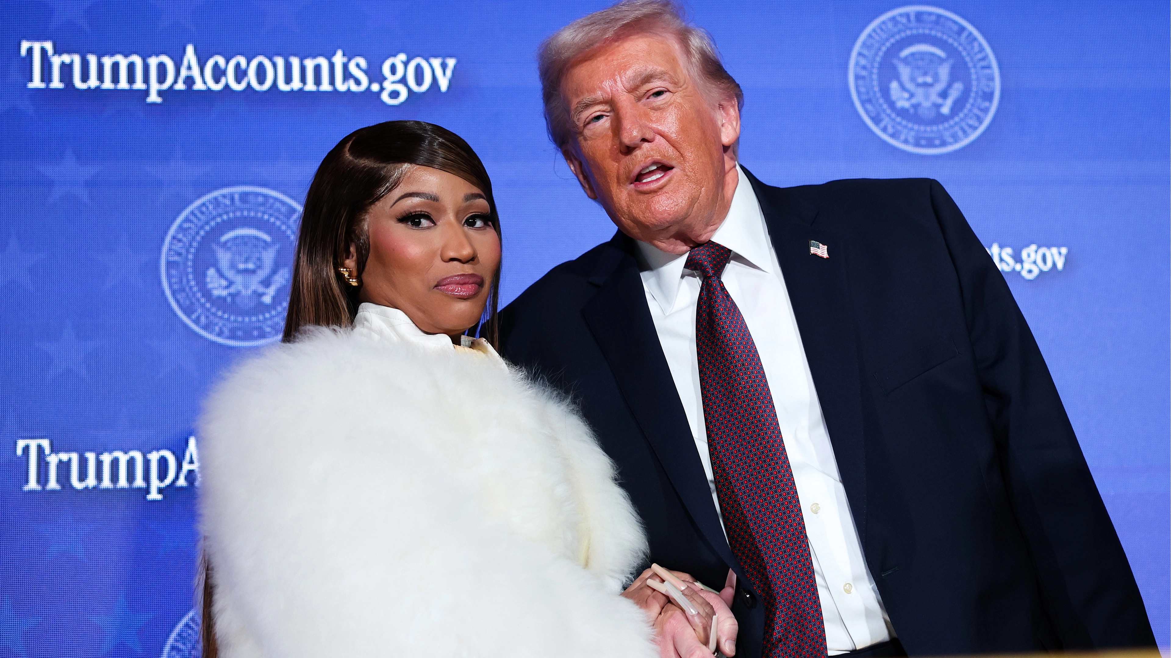 Nicki Minaj shows off $1 million Trump 'Gold Card' as she publicly defends president following citizenship controversy