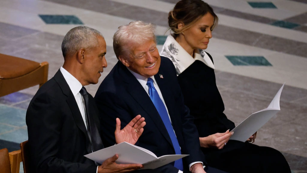 What Trump really said to Obama as they were spotted laughing at Jimmy Carter's funeral finally revealed