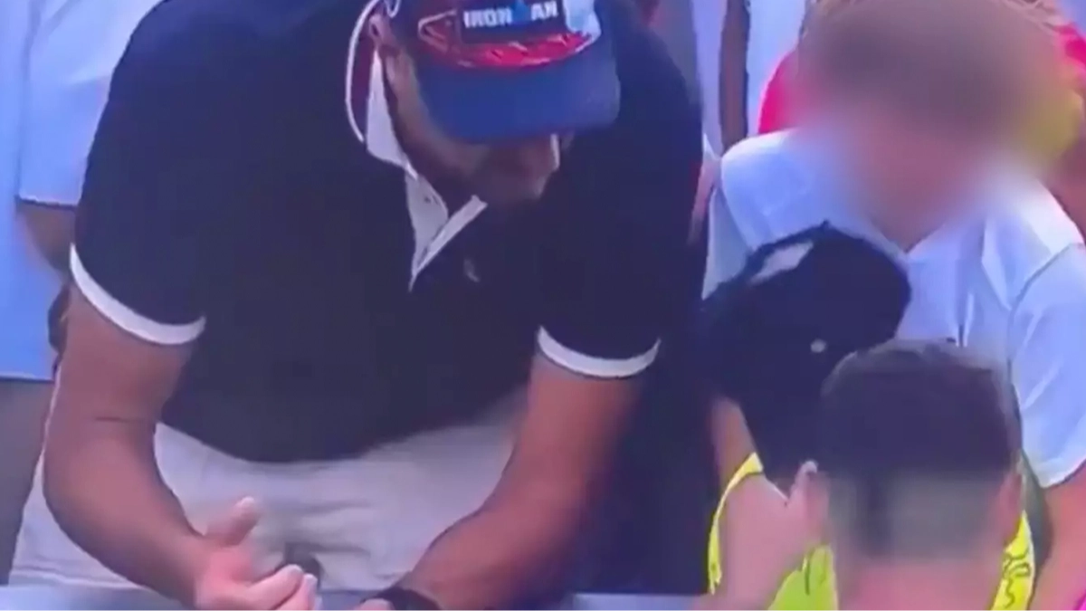 Grown man caught live on TV doing controversial act to child during US Open now identified