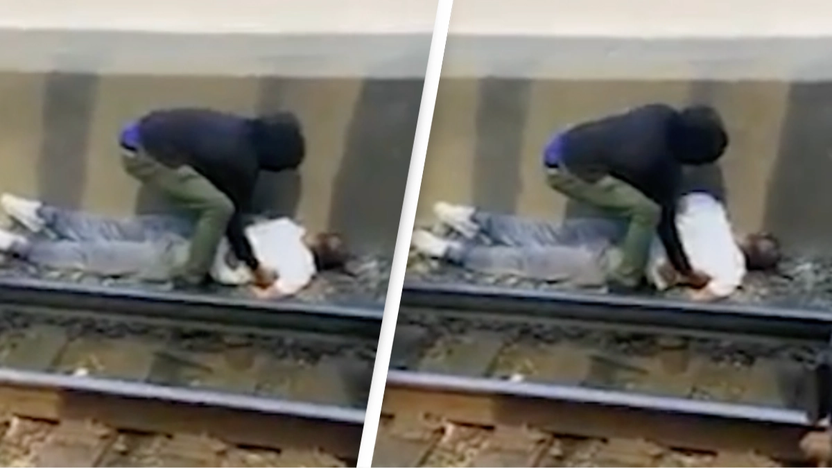 Hero pulled man off train tracks while he was electrocuted in incredible footage