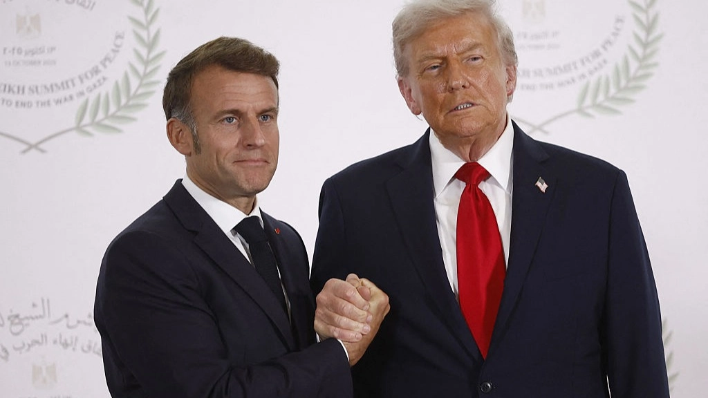 Body language expert explains what was really going on during Trump and Macron's tense 'arm-wrestle'