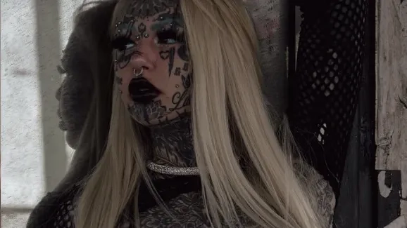 Woman who spent $250,000 on tattoos and body modifications shares what she looked like before