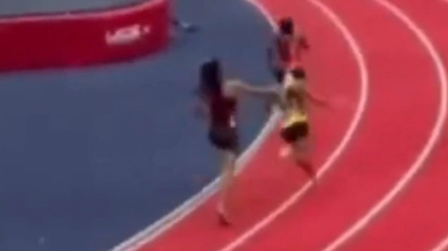 Footage shows new angle of viral moment athlete hit opponent over the head with baton as she faces assault charge