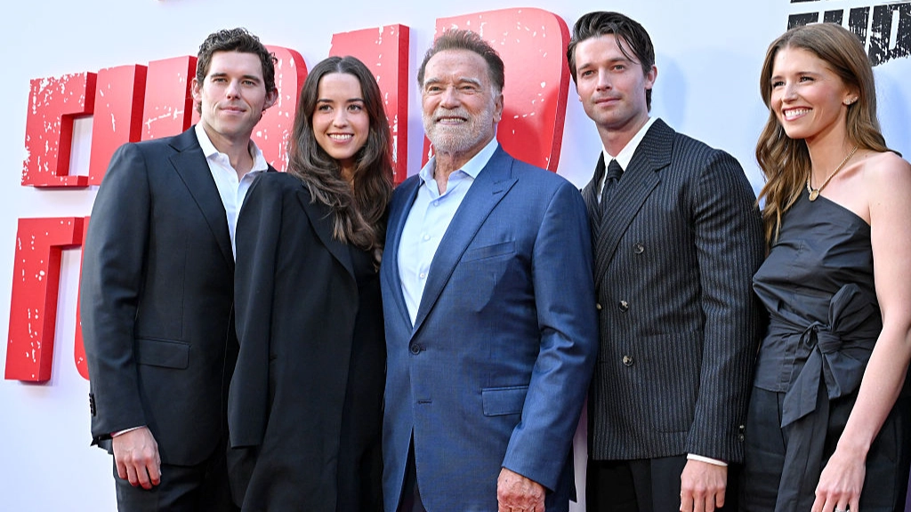 Arnold Schwarzenegger's son doesn't appear in family photo as he takes separate snap with dad alone
