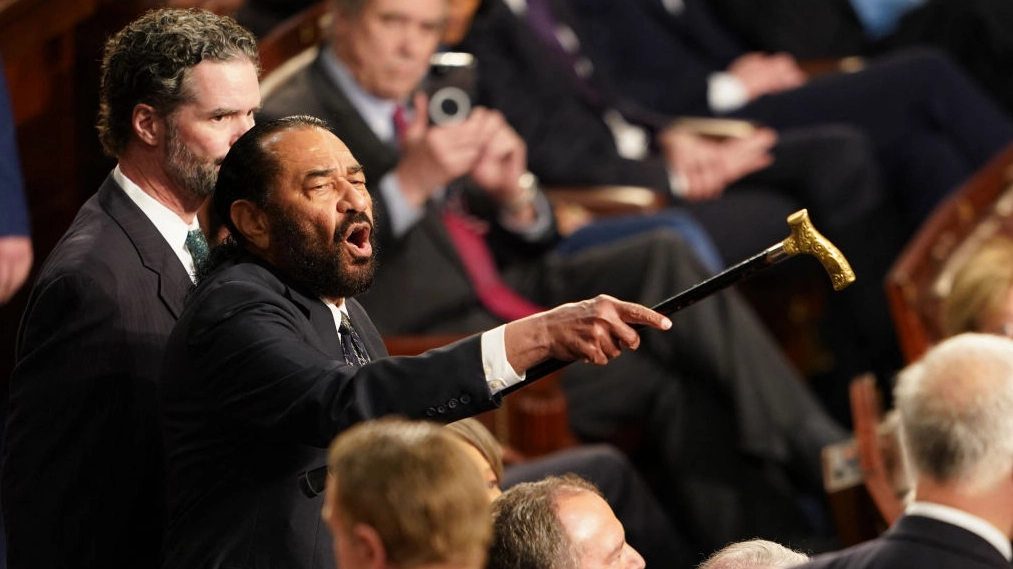 What lawmaker said before heckling caused him to be thrown out from Trump's speech to Congress