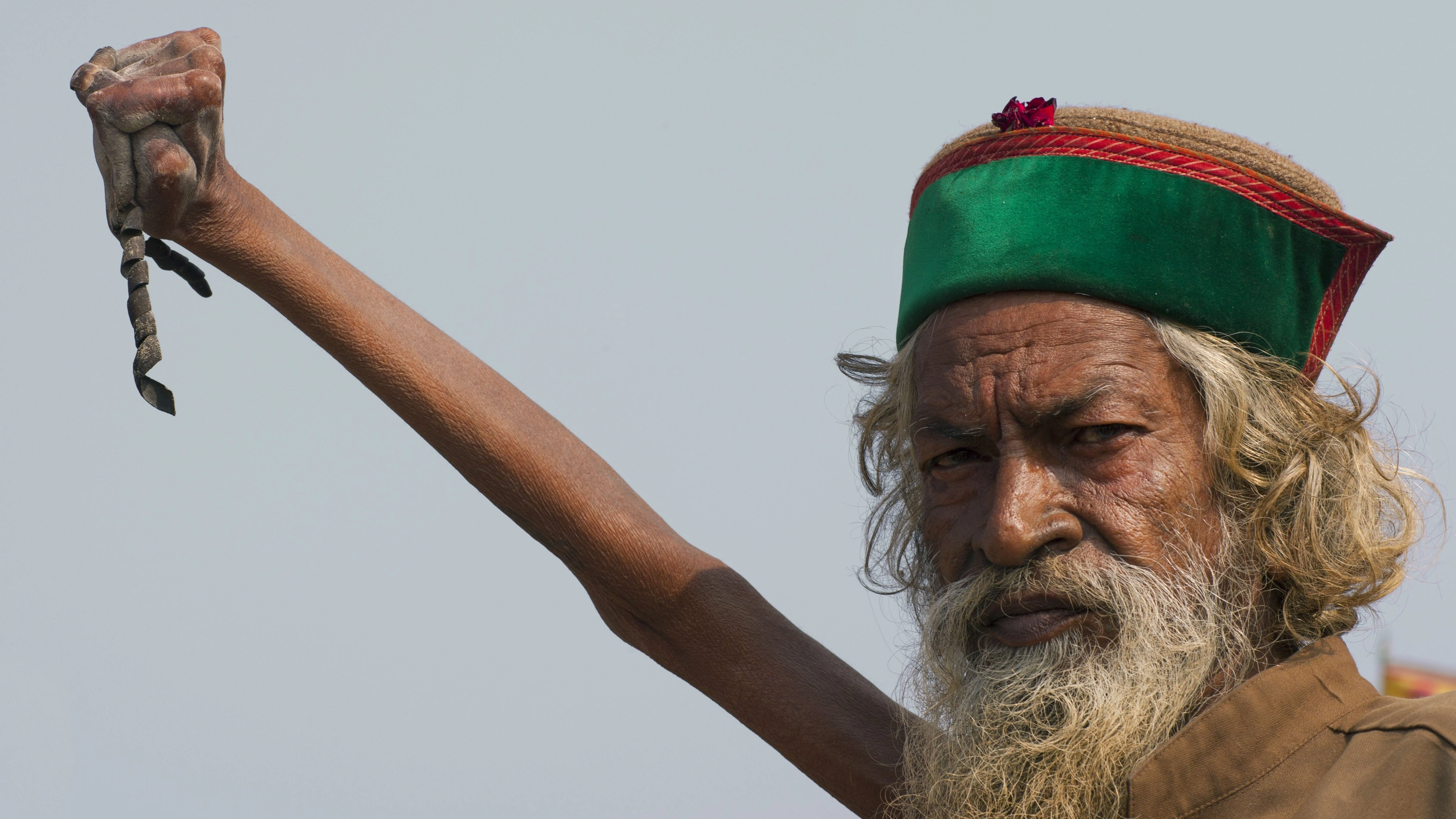 Man who’s held his arm in the air for 50 years explains why he refuses to put it down