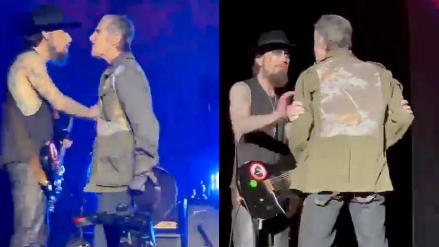 Wife of iconic band's singer who punched guitarist in shocking onstage moment explains why he did it