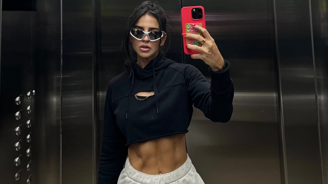 Influencer who filmed herself doing intense workout in the middle of plane aisle sparks online debate