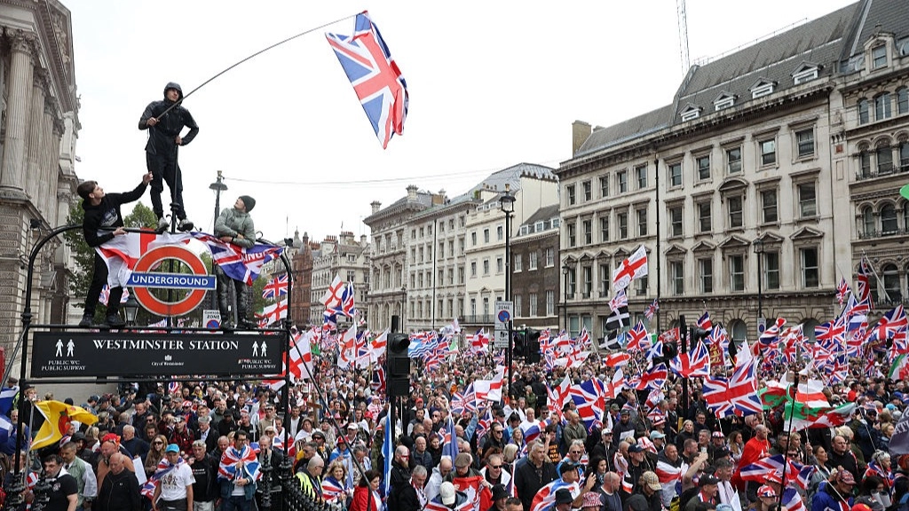 Tommy Robinson's Unite the Kingdom march trolled by giant screen set up by protestors