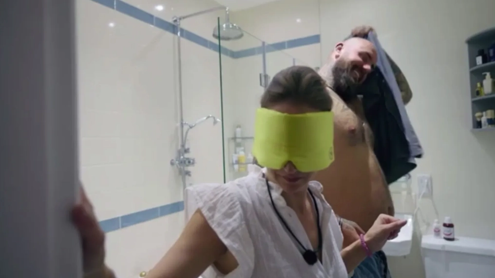Married woman showers handcuffed to adult star in 'experiment'