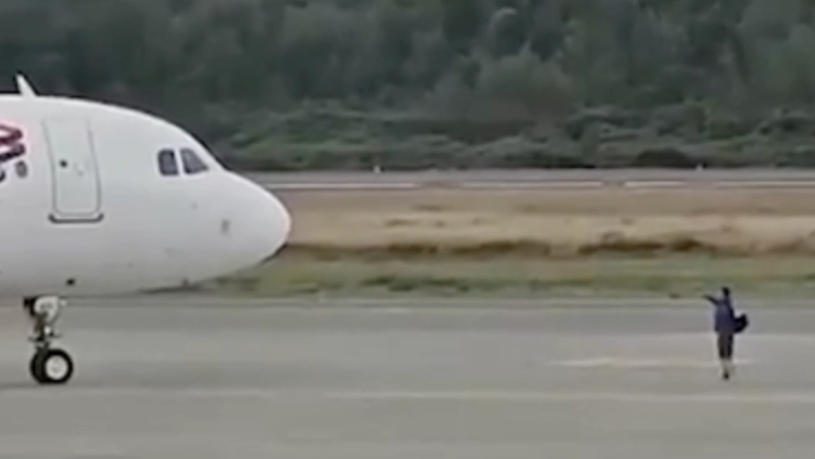 Shocking reason passenger walked onto airport runway to block plane from departing