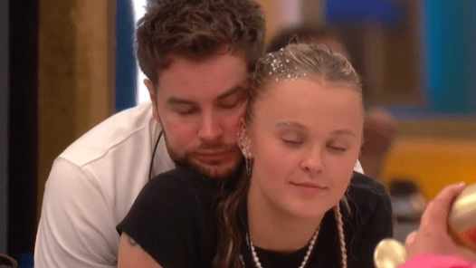 JoJo Siwa reveals what secret hand message to Chris Hughes said