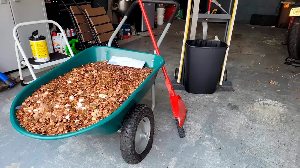 Boss Sued After Paying Worker With 90,000 Pennies Covered In Oil Amid Pay Dispute