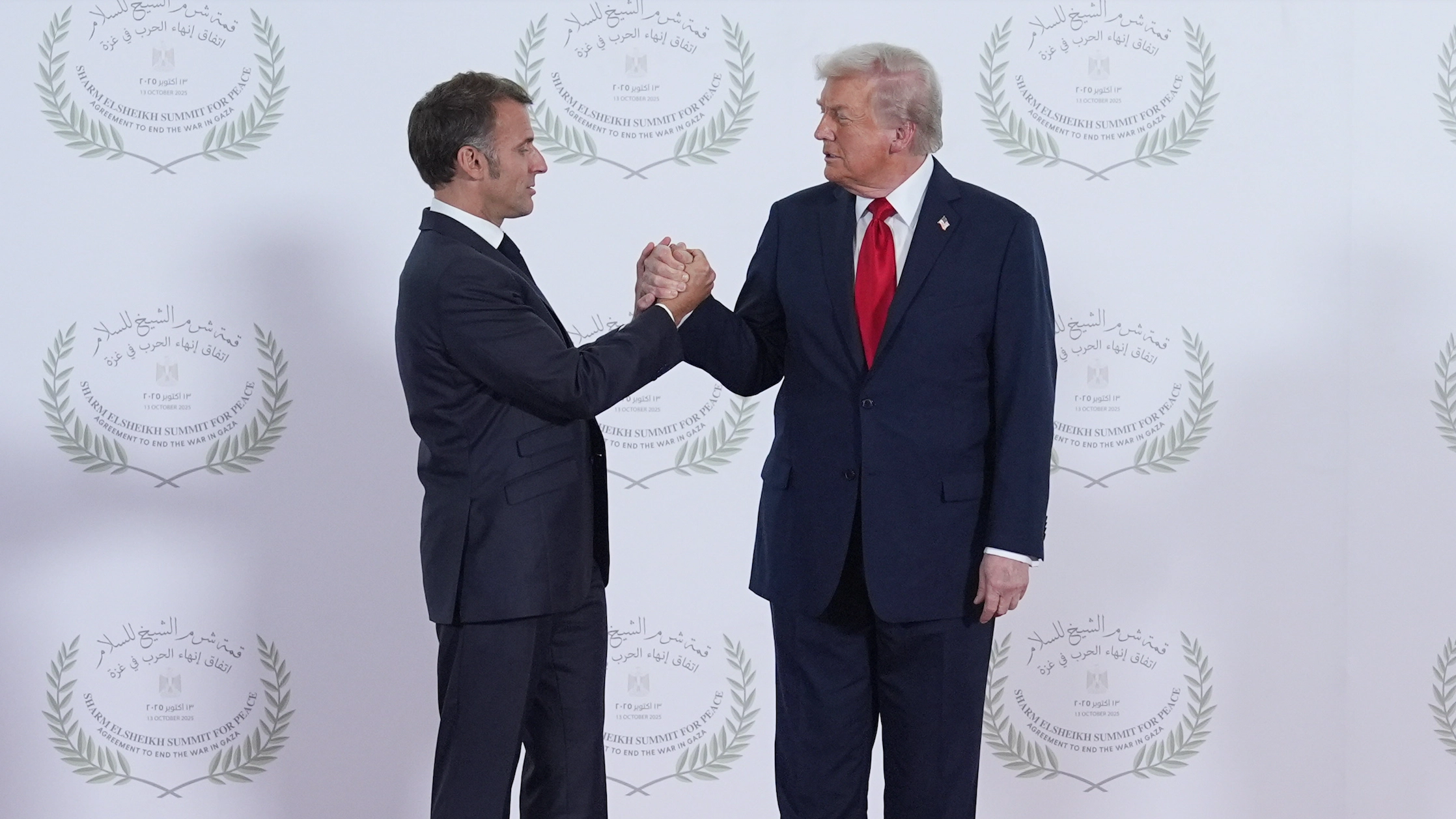 Lip reader 'decodes' Trump's five-word threat to French president Macron during tense handshake
