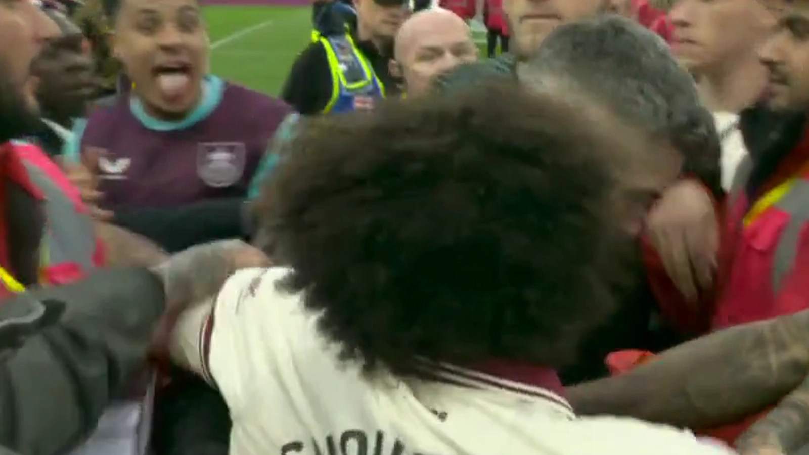 Burnley's promotion celebrations descend into chaos as players clash during pitch invasion